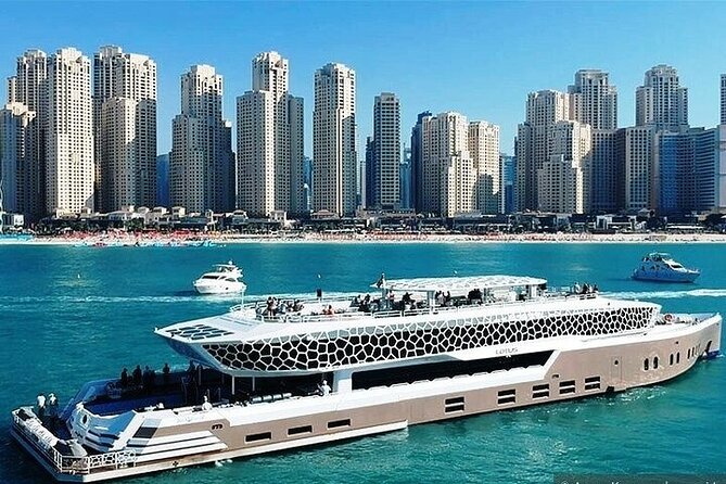 3-Hour Lotus Mega Yacht Dinner Experience in Dubai Marina - Cruising past Bluewaters, the Palm, and toward Atlantis with dinner in motion