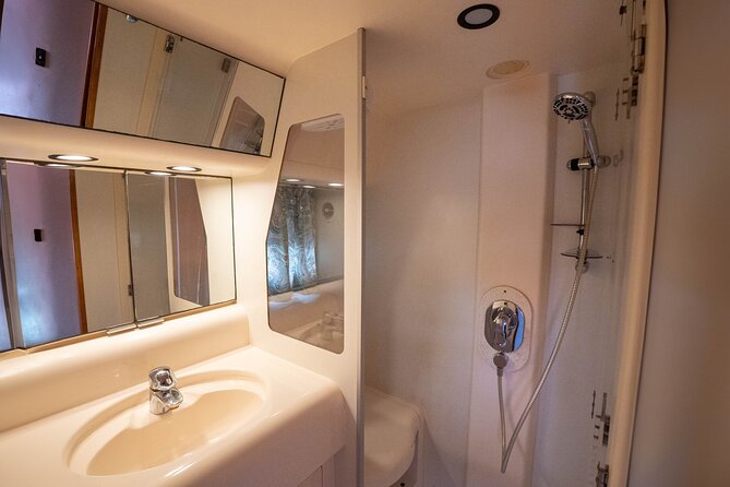 70ft + Free Hour | Miami Yacht Rental | 3 to 8 Hours | 13 ppl - Onboard comfort: Bluetooth music, restroom reality, and the cooler setup