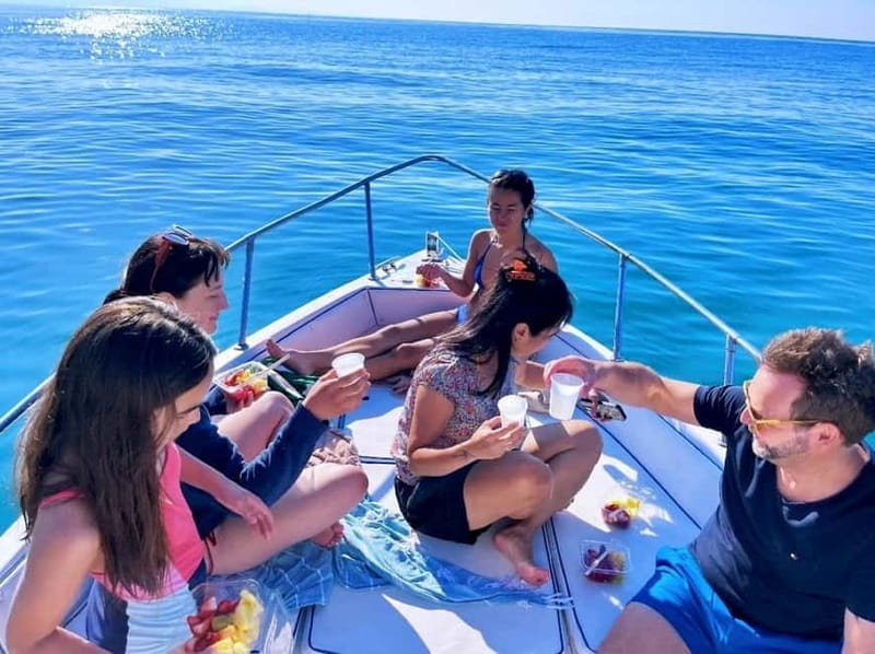 Cefalù: Mini Yacht Tour with Caves, Snorkeling, and Open Bar Aperitif - Entering The Boat Life: Meeting at Eolo Café and Getting Comfortable
