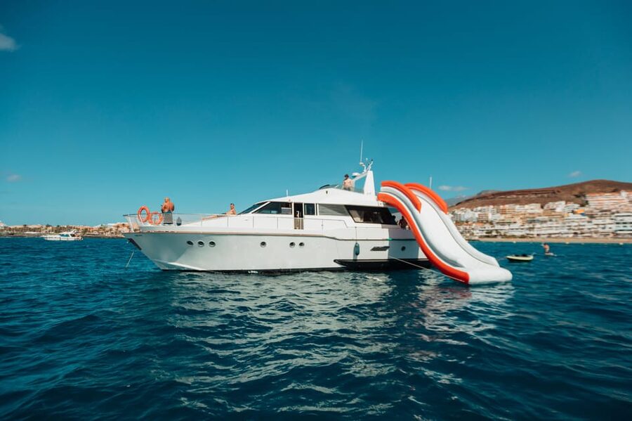 Costa Adeje: Private Yacht Trip with Watersports and Slides - Lunch and drinks aboard: Canarian comfort, plus unlimited pours
