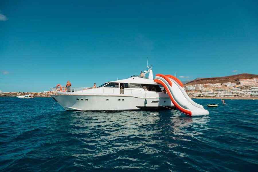 Costa Adeje: Private Yacht Trip with Watersports and Slides - Crew, kids, and the wind factor: how the day stays fun