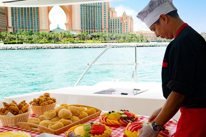 Dubai Marina Yacht Tour with Optional Breakfast or BBQ - Palm Jumeirah: where skydivers and hotel towers steal the show