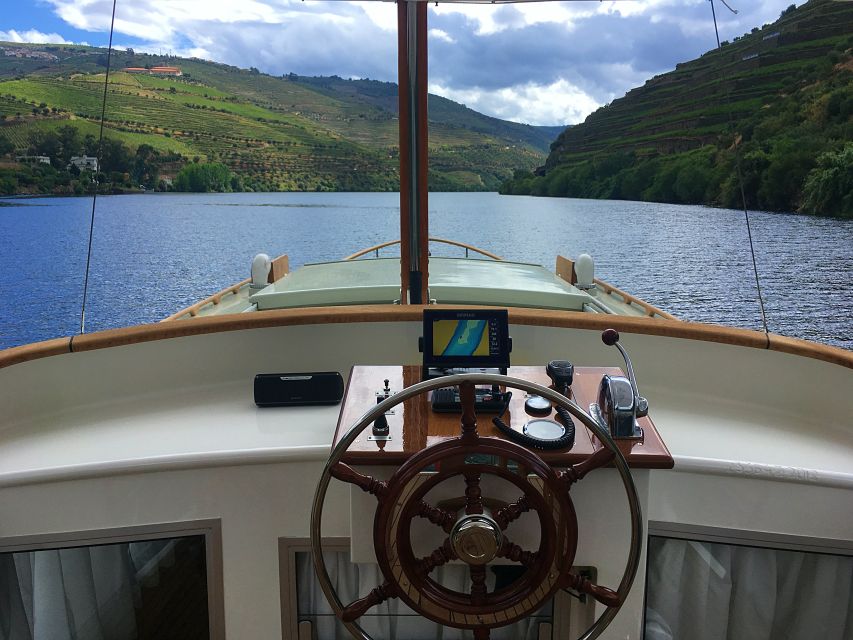 From Pinhão: Private Yacht Cruise along the Douro River - The Douro River cruise: glass lounge, open roof, and real viewing time