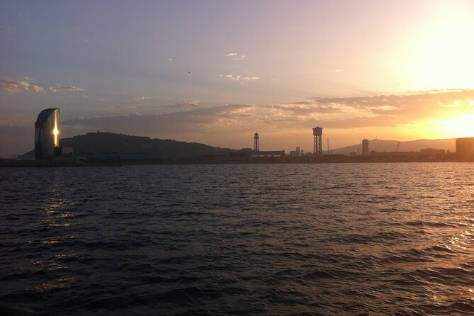 Guided Private Yacht Tour in Barcelona Spain - Montjuïc from offshore: the castle silhouette and the hillside drama