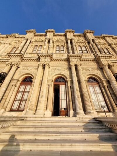 Istanbul: Dolmabahçe Palace Tour and Sunset Yacht Cruise - Boarding the yacht: snacks, tea, and the calm part of Istanbul