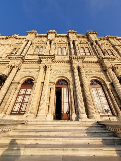 Istanbul: Dolmabahçe Palace Tour and Sunset Yacht Cruise - Boarding the yacht: snacks, tea, and the calm part of Istanbul