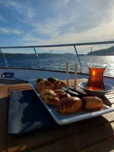 Istanbul: Sunset Yacht Cruise on the Bosphorus with Transfer - The Bosphorus route: palaces, bridges, and fort walls you can read from the water