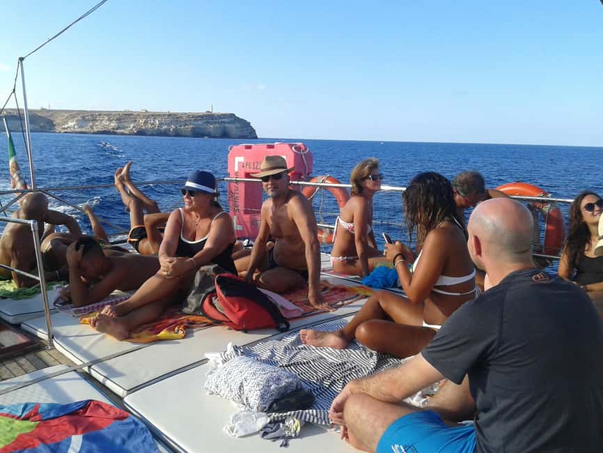 Lampedusa: Yacht excursion, swimming stops and typical lunch - Lunch on board: fish pasta, caponata, and digestif at the table