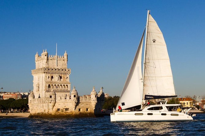Lisbon: Sunset Cruise With Drinks on Spacious Yacht - Two hours on a spacious catamaran: relaxed pace, easy viewing