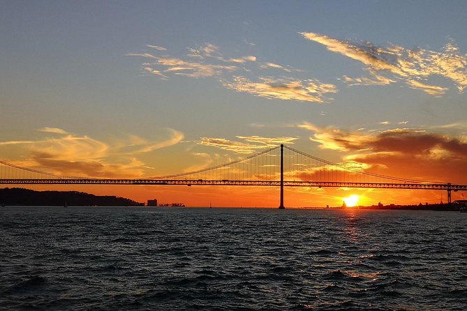 Lisbon Sunset Sailing Tour on Luxury Sailing Yacht with 2 Drinks - Drinks and cheese and chouriço: the tasty mid-cruise rhythm