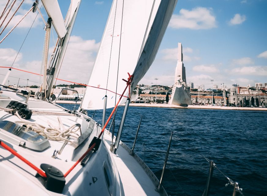 Lisbon: Yacht Sailing Tour With Portuguese Wine and History - Baixa de Lisboa: The river-level view of the city center