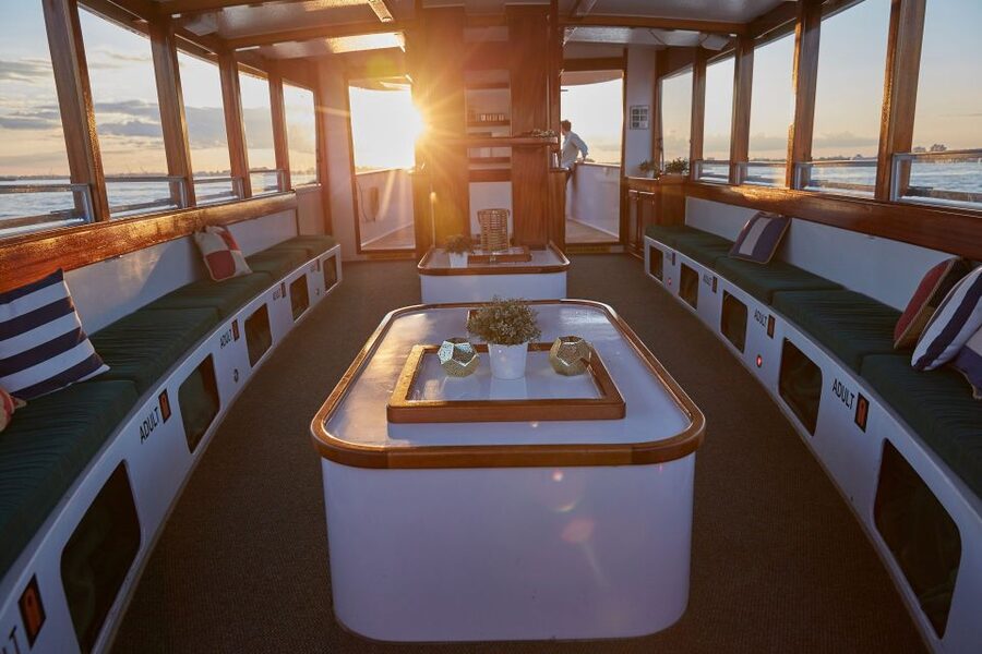 NYC: Sunset Cruise on a Small Yacht with a Drink - Open bow vs enclosed cabin: where you’ll feel the sunset best