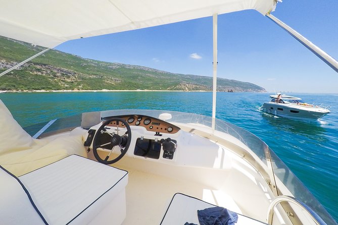 Ocean Bliss: Full Day Arrábida Private Yacht Tour from Lisbon - Portinho da Arrábida stop: swimming and water activities on a beach-focused anchor