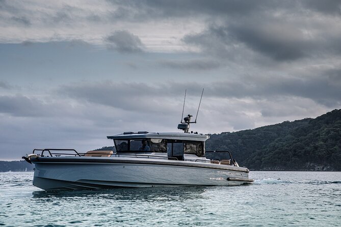 Private 5-Hour Cruise on Brand-New 2023 Motor Yacht in Mykonos (Voreus) - Paraga Beach: Scorpios and SantAnna framing the shoreline