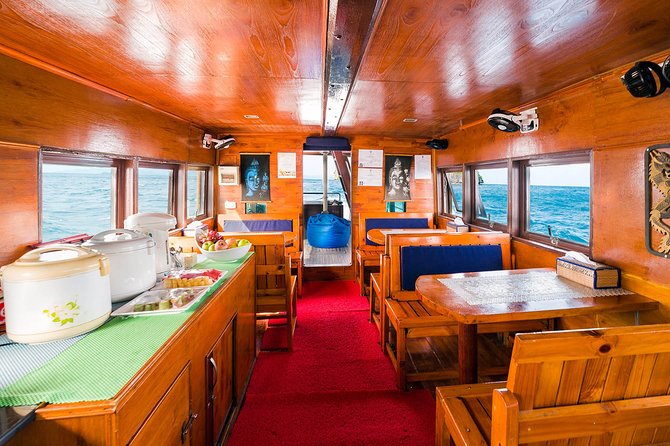 Private Full-Day Blue Dragon Yacht for Snorkeling Koh Tan & Visit Pink Dolphin - Back on board for the coastline cruise: fruit breaks and slow views