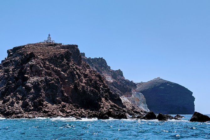 Private Full-Day Motor Yacht Cruise with Meal, Open Bar+Transfers - Thirasia snorkeling stop (30 minutes that you’ll want to use)