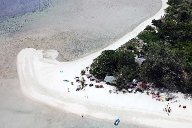 Private Full-Day Red Dragon Yacht for Snorkeling Koh Tan & Visit Pink Dolphin - Caves, bamboo dwellings, and cliffside views you can’t screenshot