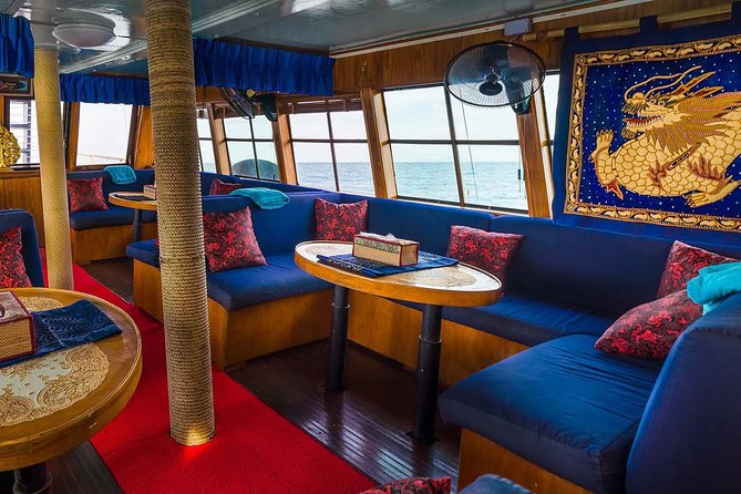 Private Full-Day Red Dragon Yacht for Snorkeling Koh Tan & Visit Pink Dolphin - The cruise back: fruits, drinks, and coastline views