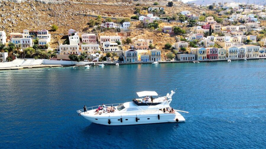 Rhodes: Symi Yacht Tour with Unlimited Drinks and Transfer - Boarding at Mandraki: Coffee, Crew Energy, and Quick Check-In