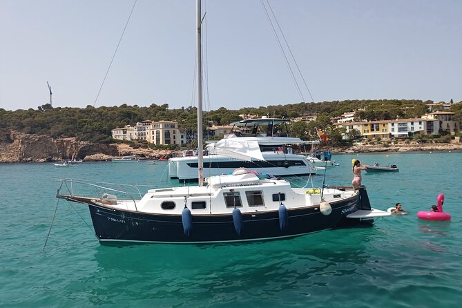 Sail boat day charter tour mallorca yacht llaut tradicional boat - A 4-hour flow: tapas, lunch, and time to get in the water