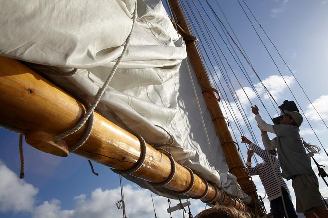 San Diego Bay Sail Aboard a Vintage Yacht Beer and Wine Included - USS Midway and Naval Air Station North Island: how the big ships look at dusk