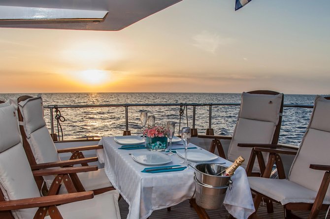 Santorini: Motor Yacht Sunset Cruise with 5-Course Dinner - Stop for swimming at Santorini Volcano: how to make the most of the 30 minutes