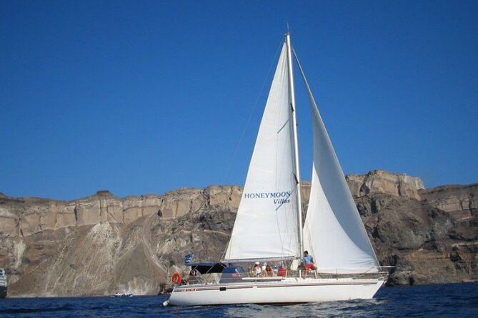 Santorini Oia: Private Sailing Yacht Cruise with Meal and Drinks - Key highlights you’ll feel right away