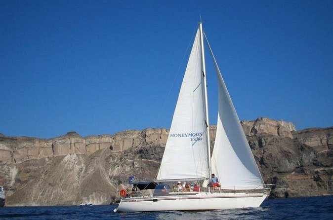 Santorini Oia: Private Sailing Yacht Cruise with Meal and Drinks - The Santorini volcano and sulfur springs area: black rocks, sea views, and optional water time