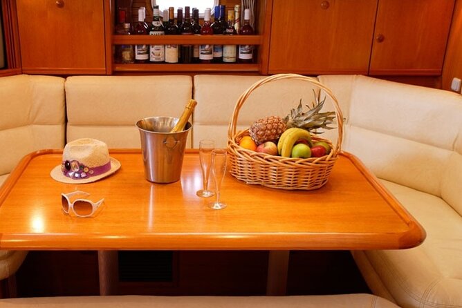 Santorini: Private Sailing Yacht Cruise with Meal and Drinks - Nea Kameni: snorkeling with an onboard dinner experience