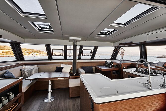 Santorini Private Tour Half-Day Sailing Platinum Catamaran Cruise - Akrotiri village lighthouse: the cliffside viewpoint you can actually breathe at