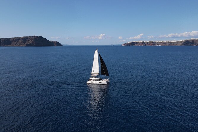 Santorini Private Tour Half-Day Sailing Platinum Catamaran Cruise - Getting there: Vlichada meeting point and optional private minivan pickup