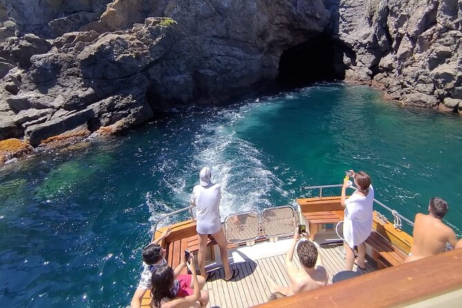 Tour of Ischia Island with Motor Yacht Rocca Corsa - Baia di San Montano Lunch: Seafood, Wine, and Captain’s Pastry Energy