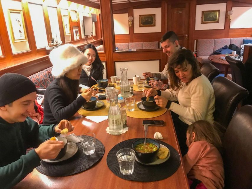Tromsø: Luxury Polar Fjord Cruise w/ Hot Tub & Polar Plunge - Lunch and conversation: Captain Kenneth and the crew touch