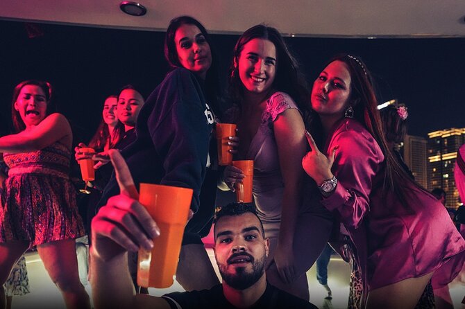 Ultimate Dubai Marina Yacht Party with BBQ, Drinks & DJ - Dubai Marina skyline and Dubai Eye at night: the photo payoff