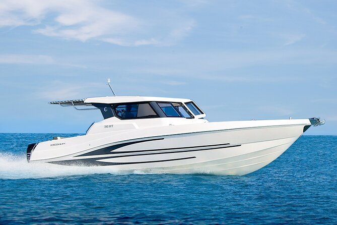 Yachting in Dubai: Book 36 ft Yacht Charter up to 10 people - Passing a Waterfront Residential Scene (Luxury, But Less Obvious)
